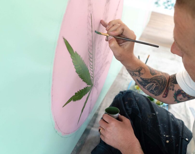 Man painting graphic